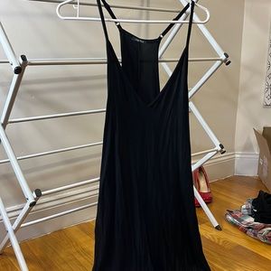 Black cotton overalls- I am 5 2 and the the sides are lower on me